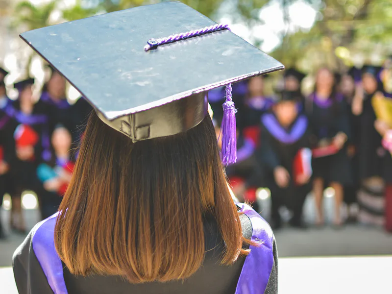Graduate wearing a cap and gown